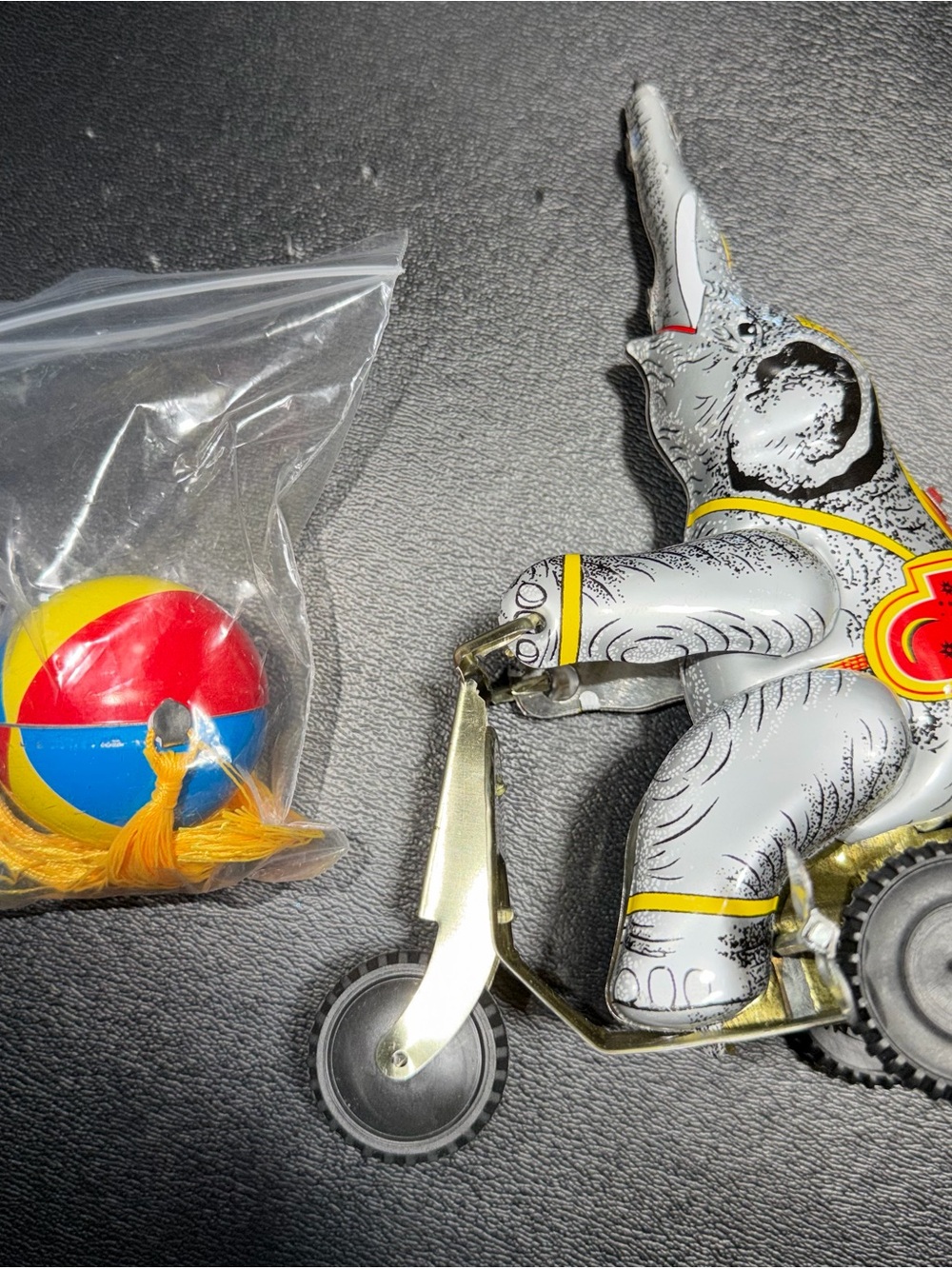 Vintage Tin Elephant Tricycle Toy with Colorful Ball - White & Yellow